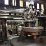 JANUARY - First Place - Crankin’ It Up!<br />Benjamin Castic, Local Lodge 41, Southside Machine Works, St. Louis, MO<br />Robert Eddleman, wearing his safety harness, machines a crank shaft on a vertical boring mill.<br />